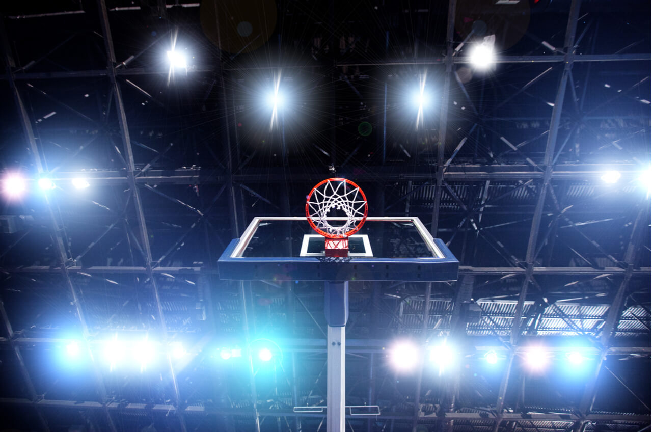 low angle shot of basketball hoop and lights