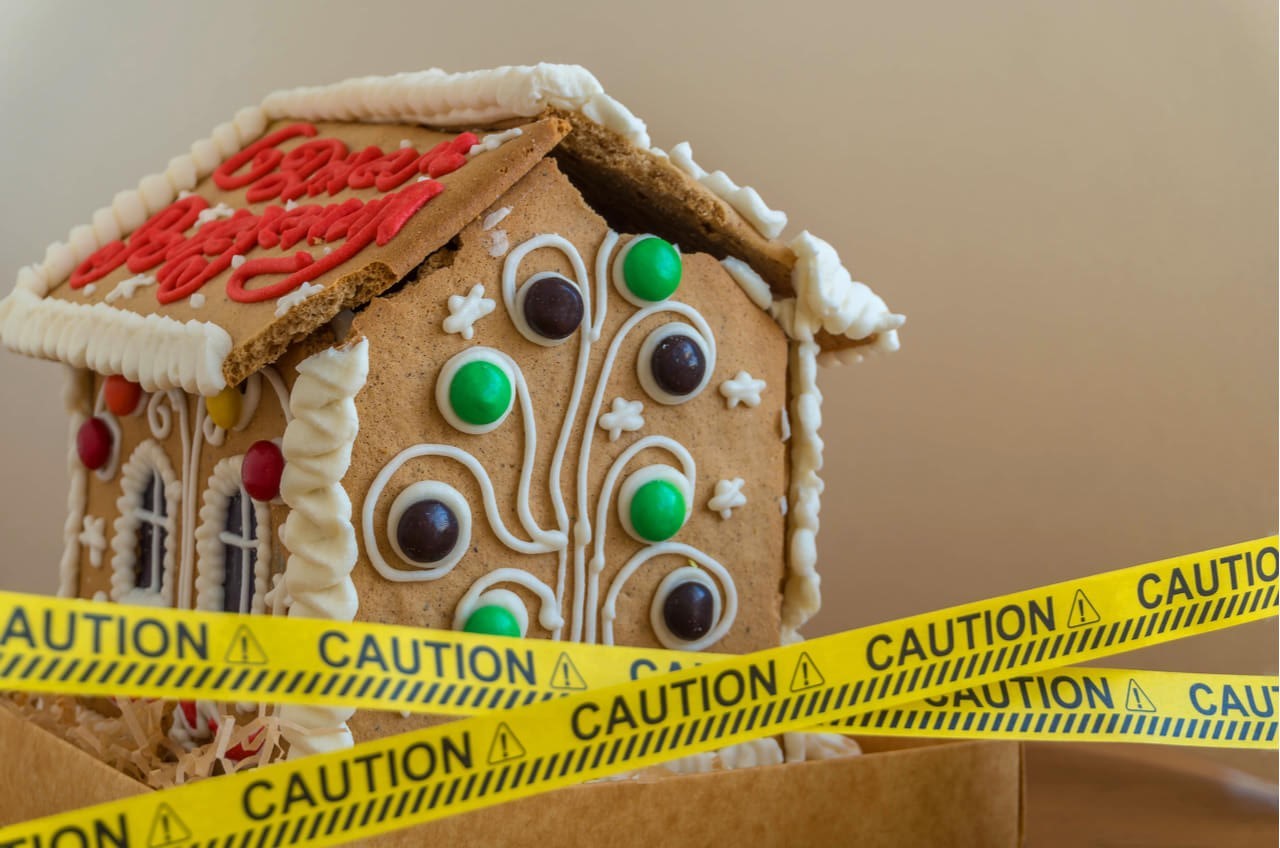 gingerbread house with caution tape