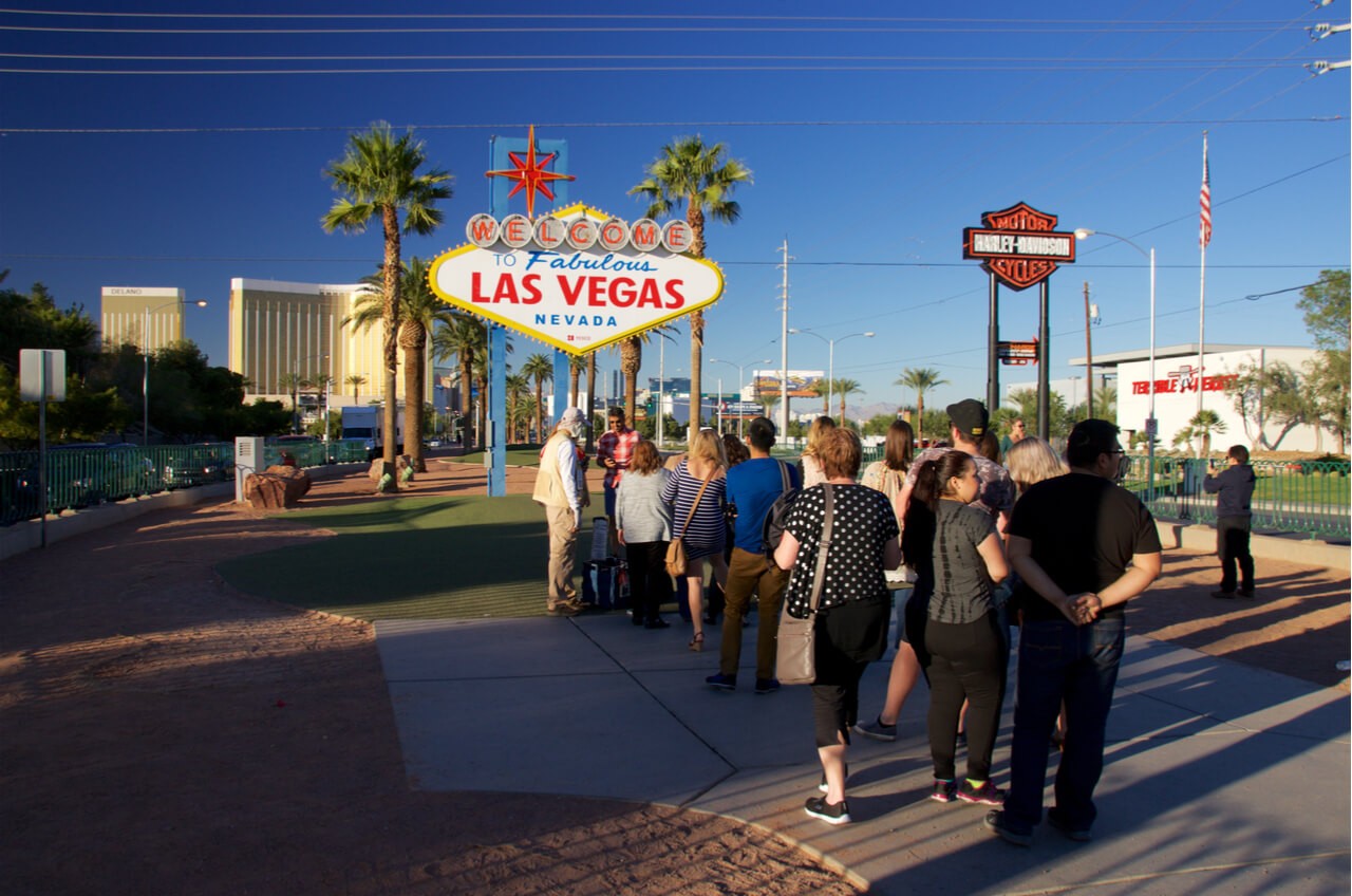 Line of people at Welcome to Las Vegas sign